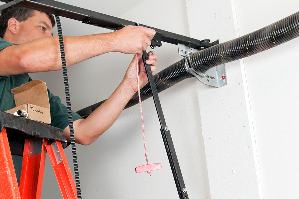 man installing garage door 