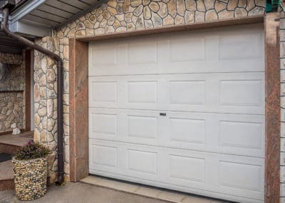 Front view of a white attached garage door