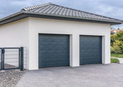 Side view of a detached garage with two doors