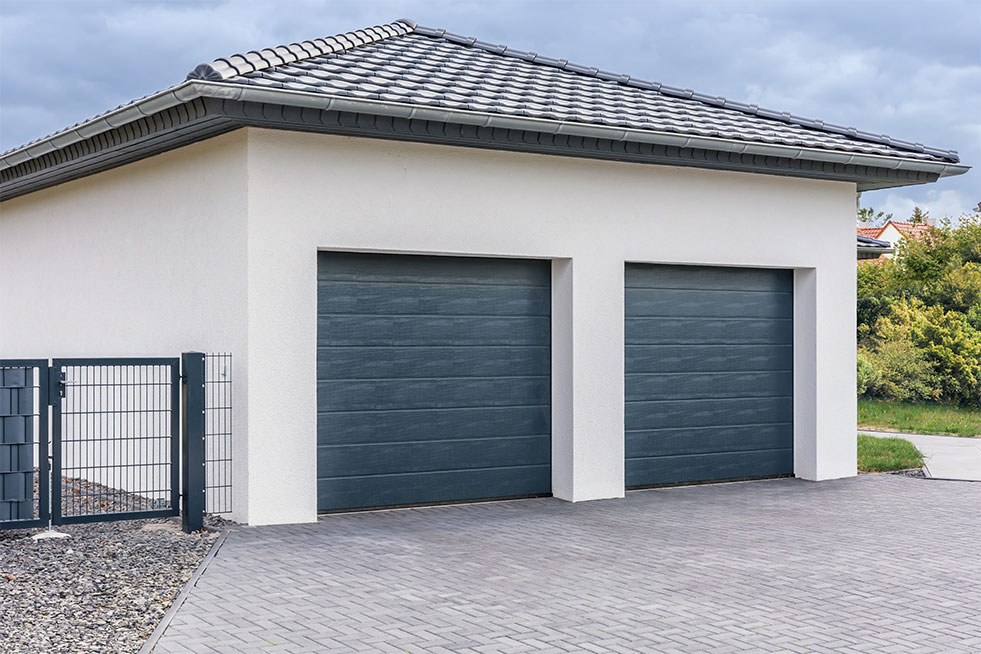 side view of a garage with two doors