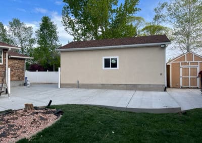 Side view of a tan detached garage