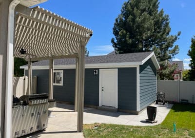 Side view of a blue detached garage