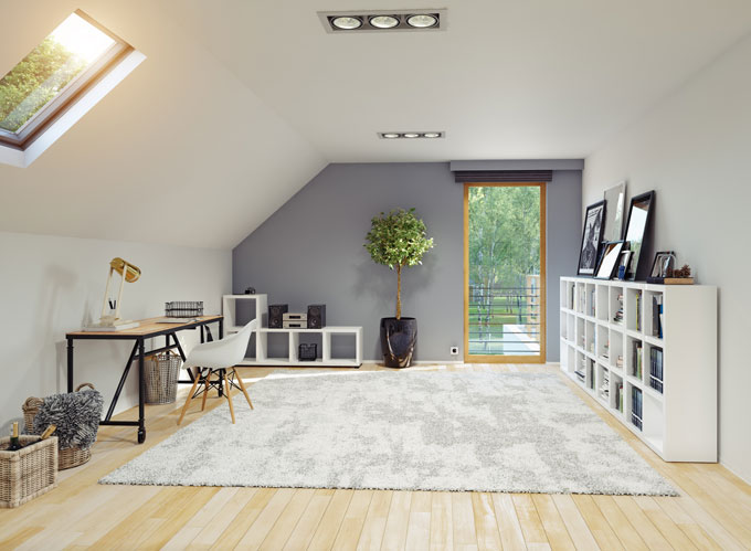 A loft converted into a living space above a garage