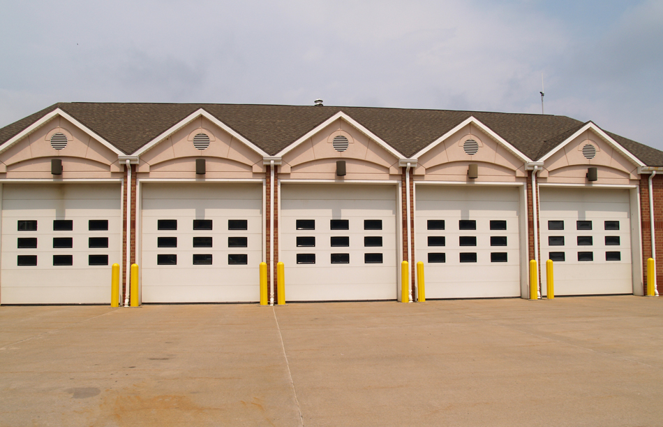 Large-garage-doors_97784411 Side view of a detached garage with two doors